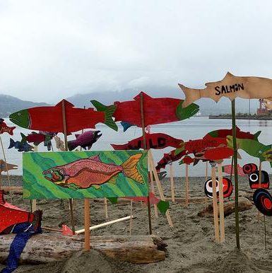 Salmon stick decorations and artwork by the waterside near Crab Park. Photo by Murray Bush.